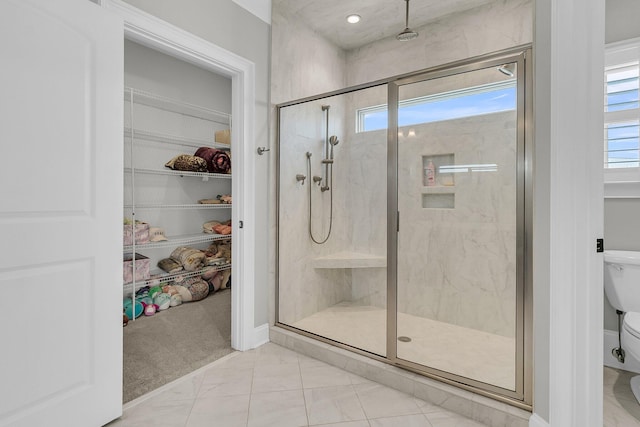 1720 Bowline Dr, Mount Pleasant, SC 29466 - full bath featuring a shower stall, toilet, a walk in closet, and marble finish flooring