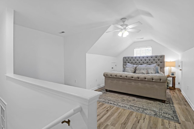 bedroom with lofted ceiling, ceiling fan, and light hardwood / wood-style floors