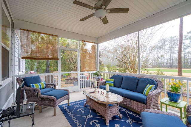 sunroom with a wealth of natural light and ceiling fan