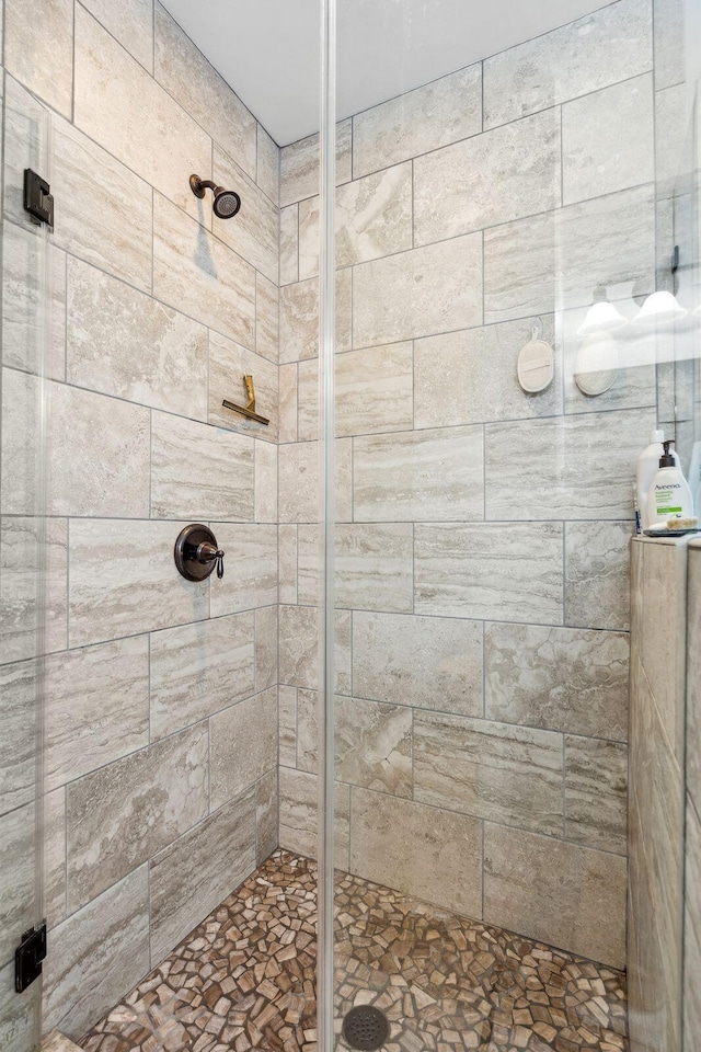 full bathroom with tiled shower