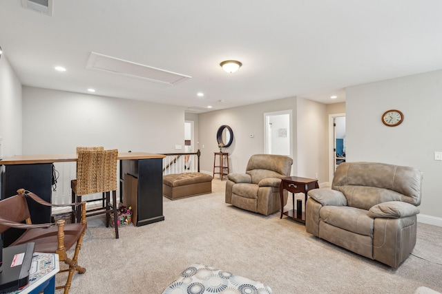 carpeted living room with recessed lighting, visible vents, baseboards, and attic access