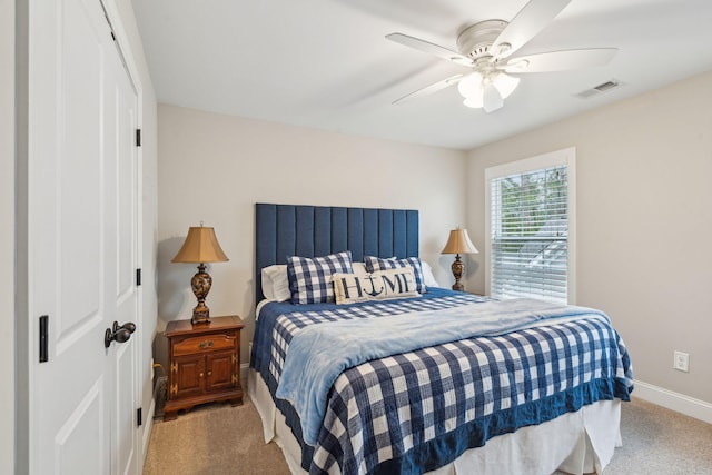 bedroom with a closet, baseboards, visible vents, and carpet floors