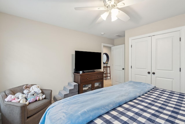 bedroom with a closet, visible vents, and a ceiling fan