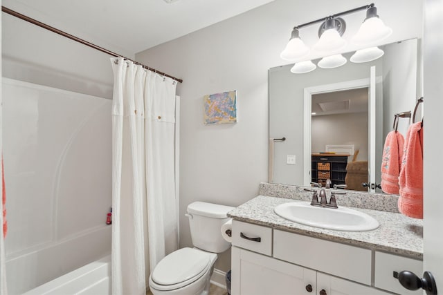 bathroom featuring vanity, toilet, and shower / bath combo with shower curtain