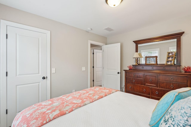 bedroom with visible vents