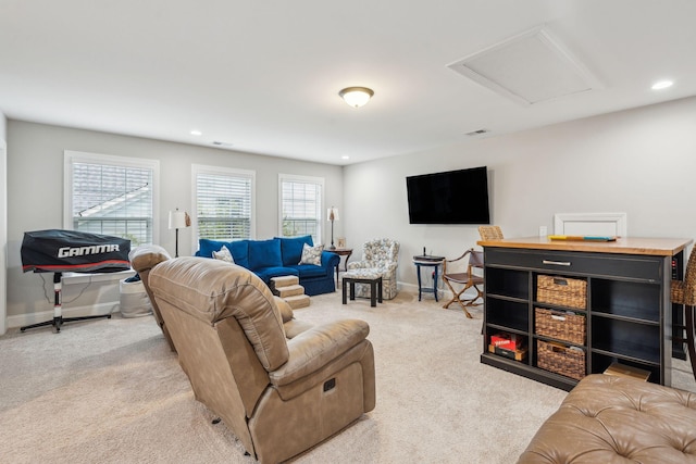 living room with baseboards, carpet floors, visible vents, attic access, and recessed lighting