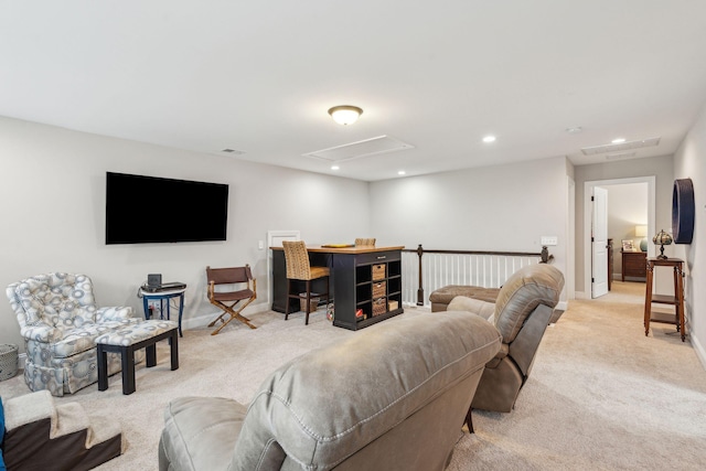 living room featuring recessed lighting, light colored carpet, attic access, and baseboards