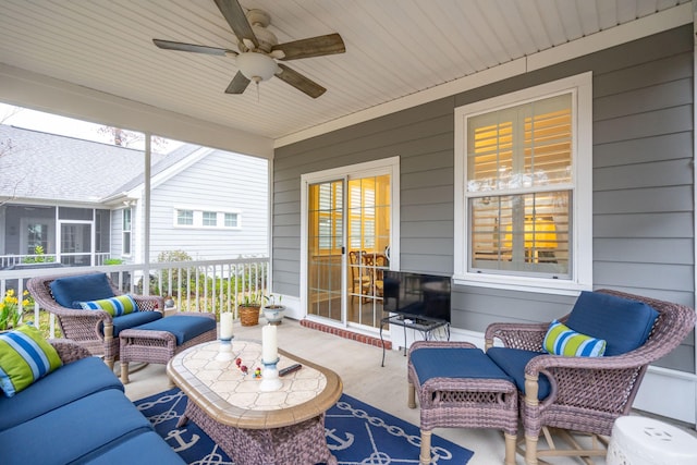 sunroom / solarium featuring ceiling fan