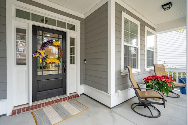 property entrance with covered porch