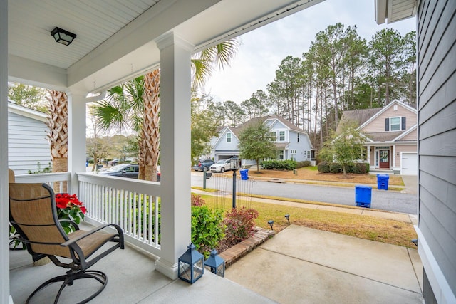 view of patio with a residential view and covered porch