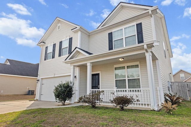 traditional-style house with a porch, central AC, driveway, and an attached garage