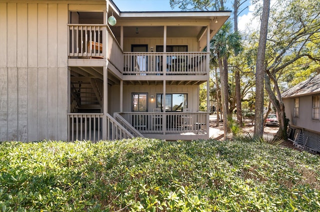 rear view of property featuring a balcony