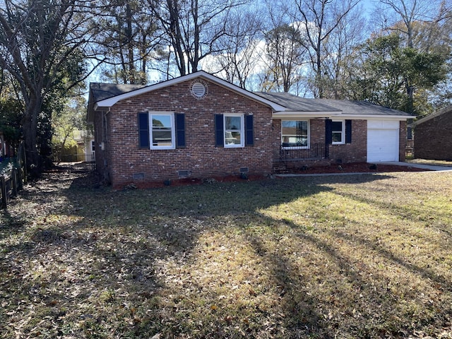 single story home featuring a garage and a front yard