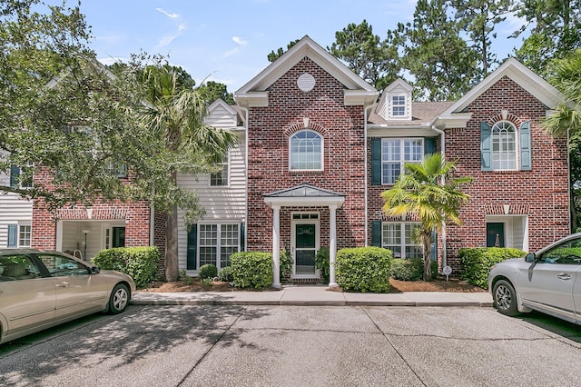 1682 Camfield Ln, Mount Pleasant, SC 29466 - view of front facade featuring uncovered parking and brick siding