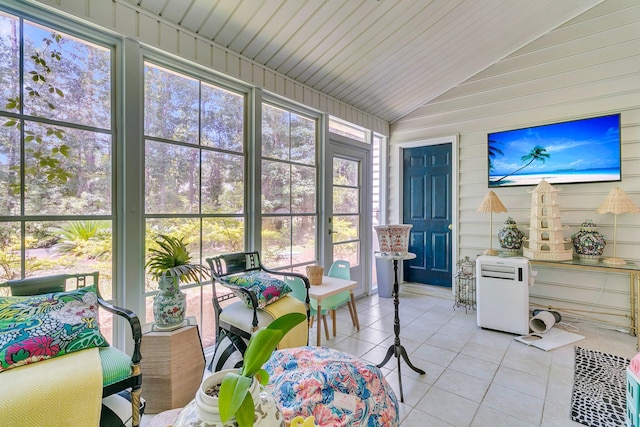 1682 Camfield Ln, Mount Pleasant, SC 29466 - sunroom / solarium with tile patterned flooring, vaulted ceiling, plenty of natural light, and wood walls