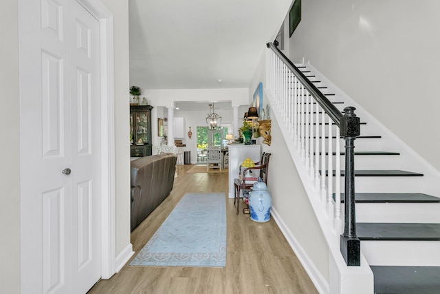 1682 Camfield Ln, Mount Pleasant, SC 29466 - entryway with light wood-style flooring, stairway, and a chandelier
