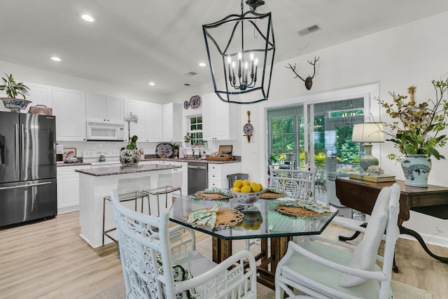 1682 Camfield Ln, Mount Pleasant, SC 29466 - dining room featuring a chandelier, light wood finished floors, and recessed lighting