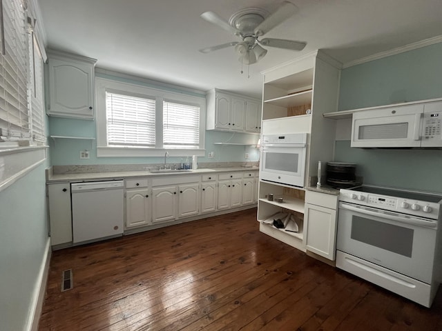 kitchen with sink, white appliances, dark wood-type flooring, white cabinetry, and ornamental molding