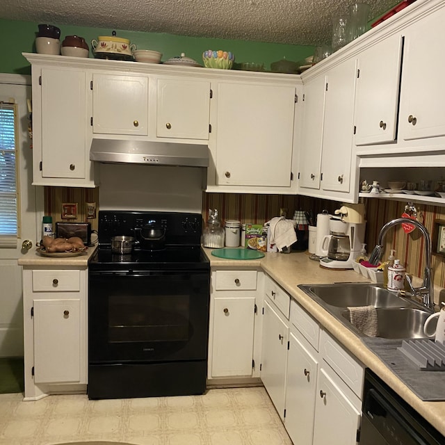 kitchen featuring under cabinet range hood, black electric range, light floors, a sink, and dishwashing machine