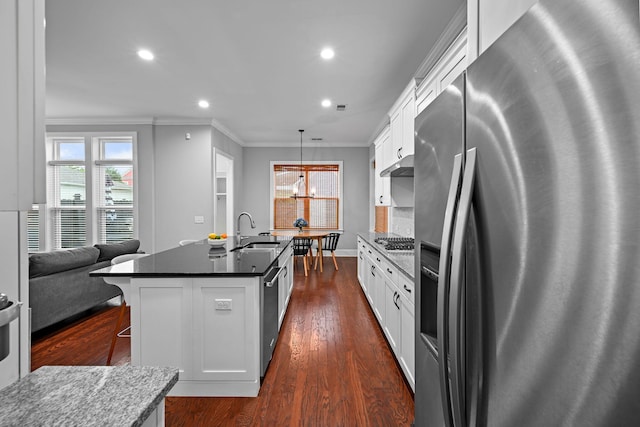410 Eliston St, Summerville, SC 29486 - kitchen featuring stainless steel appliances, a sink, crown molding, white cabinets, and a kitchen island with sink