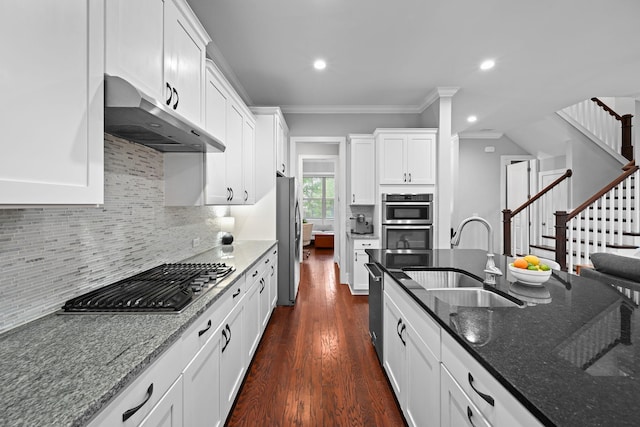 410 Eliston St, Summerville, SC 29486 - kitchen featuring stainless steel appliances, under cabinet range hood, a sink, dark wood finished floors, and crown molding
