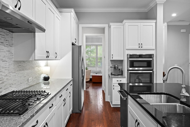 410 Eliston St, Summerville, SC 29486 - kitchen with under cabinet range hood, stainless steel appliances, a sink, white cabinets, and crown molding