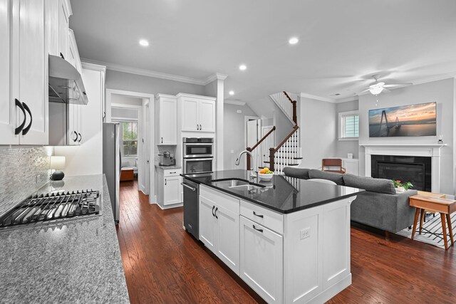 410 Eliston St, Summerville, SC 29486 - kitchen with a sink, stainless steel appliances, recessed lighting, decorative backsplash, and ornamental molding