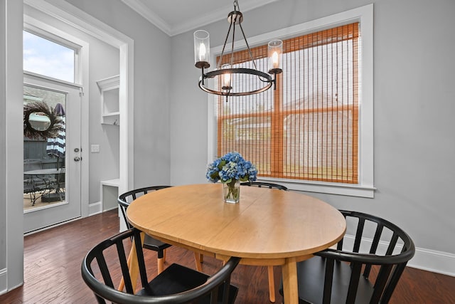 410 Eliston St, Summerville, SC 29486 - dining space with ornamental molding, a chandelier, wood finished floors, and baseboards