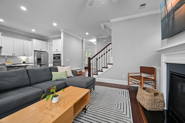 410 Eliston St, Summerville, SC 29486 - living room featuring dark wood-style flooring, ornamental molding, recessed lighting, stairs, and ceiling fan