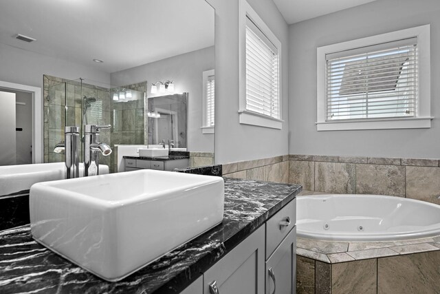 410 Eliston St, Summerville, SC 29486 - bathroom featuring a shower stall, a tub with jets, and vanity