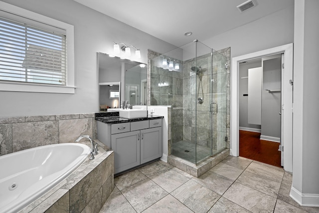 410 Eliston St, Summerville, SC 29486 - bathroom with a shower stall, vanity, a tub with jets, and tile patterned floors