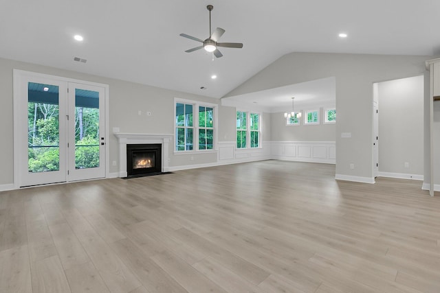395 Wappoo Trace Ln, Summerville, SC 29486 - unfurnished living room featuring a ceiling fan, vaulted ceiling, a chandelier, plenty of natural light, and a fireplace with flush hearth