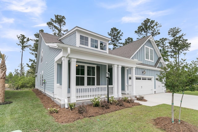 395 Wappoo Trace Ln, Summerville, SC 29486 - view of front facade featuring covered porch, board and batten siding, concrete driveway, and a front lawn