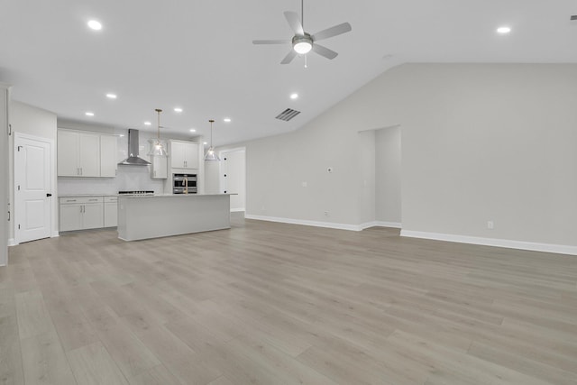 395 Wappoo Trace Ln, Summerville, SC 29486 - unfurnished living room with a ceiling fan, recessed lighting, light wood-style flooring, lofted ceiling, and baseboards