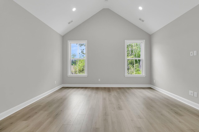 395 Wappoo Trace Ln, Summerville, SC 29486 - empty room with healthy amount of natural light, light wood-style flooring, vaulted ceiling, baseboards, and recessed lighting
