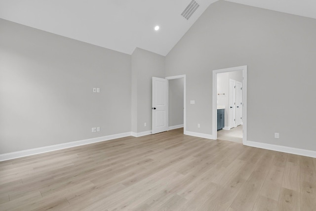 395 Wappoo Trace Ln, Summerville, SC 29486 - unfurnished bedroom featuring high vaulted ceiling, baseboards, light wood-style flooring, ensuite bath, and recessed lighting