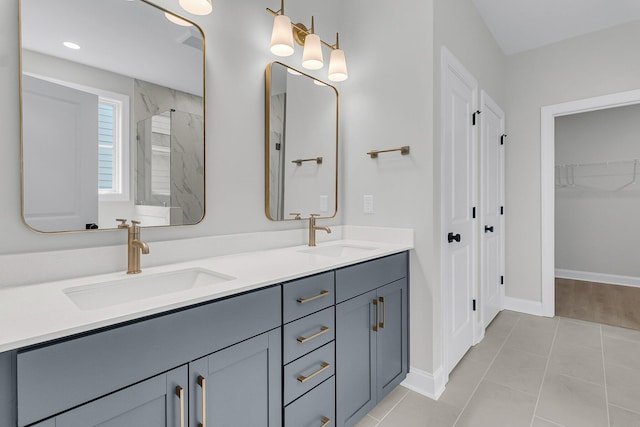 395 Wappoo Trace Ln, Summerville, SC 29486 - full bath with a marble finish shower, double vanity, tile patterned floors, a spacious closet, and baseboards