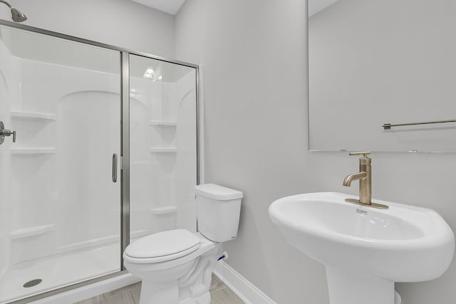 395 Wappoo Trace Ln, Summerville, SC 29486 - bathroom with a shower stall, toilet, and baseboards