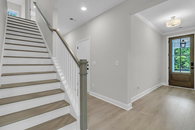 395 Wappoo Trace Ln, Summerville, SC 29486 - entryway with stairway, light wood finished floors, crown molding, baseboards, and recessed lighting