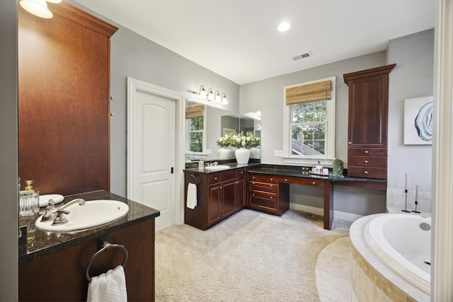 2206 Weepoolow Trl, Charleston, SC 29407 - full bath with two vanities, a garden tub, and recessed lighting