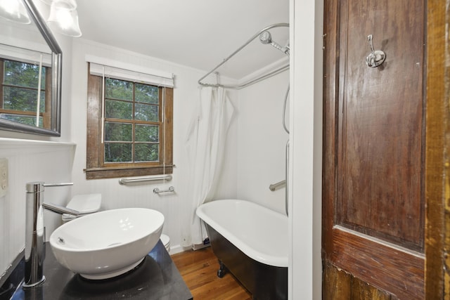 2206 Weepoolow Trl, Charleston, SC 29407 - full bath featuring a freestanding tub, wood finished floors, and curtained shower