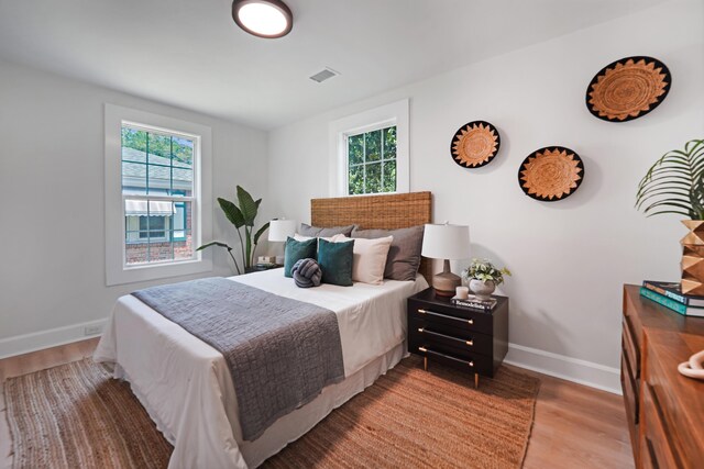 2608 Seymour Ave, North Charleston, SC 29405 - bedroom featuring multiple windows and wood finished floors