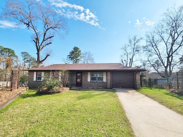 ranch-style home featuring a garage and a front yard