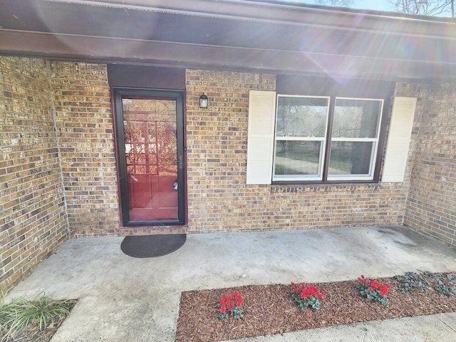 property entrance with a patio area