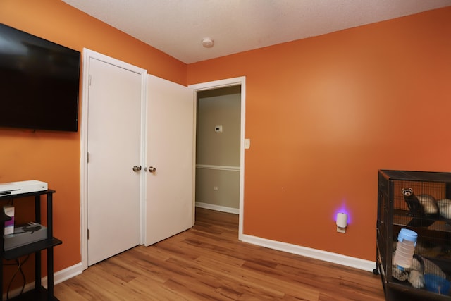 bedroom with light hardwood / wood-style flooring