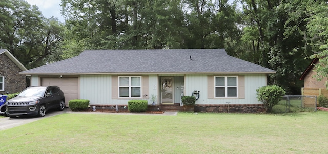 single story home with a front yard and a garage