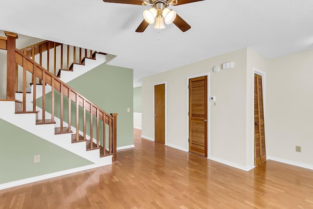 interior space with light wood-type flooring and ceiling fan