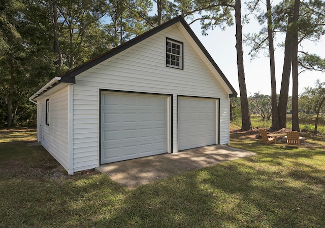 garage featuring a yard