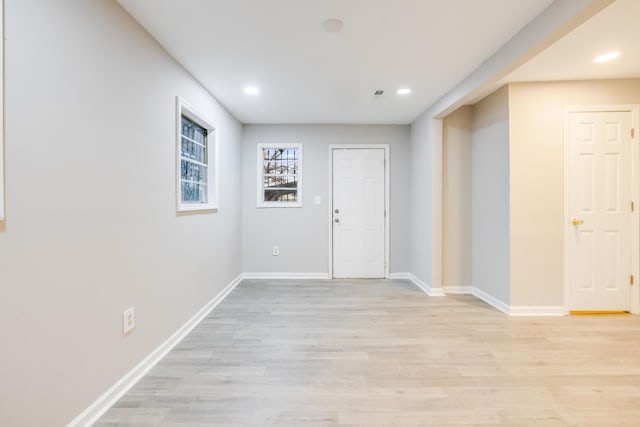 entrance foyer with light hardwood / wood-style flooring