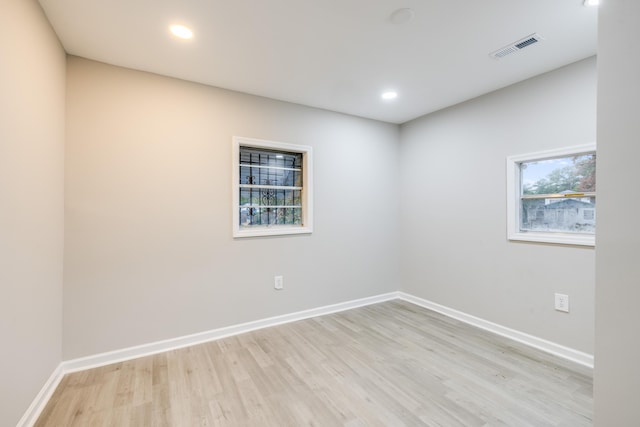 unfurnished room with light hardwood / wood-style floors